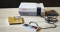 An original Nintendo NES video game system is shown in this stock photo.