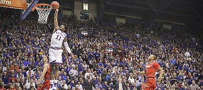 Kansas guard Josh Jackson (11) comes in for a breakaway dunk during the first half against Texas Tech, Saturday, Jan. 7, 2017 at Allen Fieldhouse.