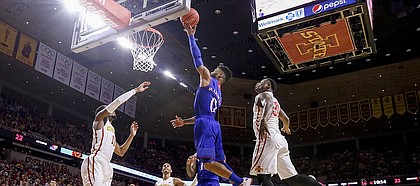 Kansas guard Frank Mason III (0) gets in for a bucket past Iowa State guard Deonte Burton (30) during the first half, Monday, Jan. 16, 2017 at Hilton Coliseum.