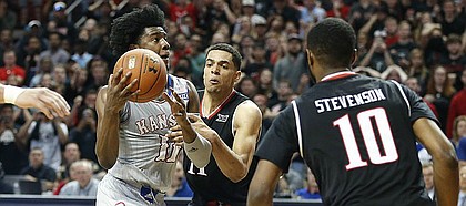 Kansas guard Josh Jackson (11) is fouled on the drive by Texas Tech forward Zach Smith (11) with seconds remaining in regulation, Saturday, Feb. 11, 2017 at United Supermarkets Arena in Lubbock, Texas. The foul put Jackson at the free throw line where he hit the second of two shots to give the Jayhawks a one-point lead and ultimately, the win.