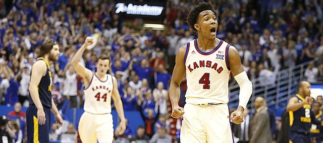 Kansas guard Devonte' Graham (4) gets fired up as the Jayhawks close in on the West Virginia lead during the second half, Monday, Feb. 13, 2017 at Allen Fieldhouse.