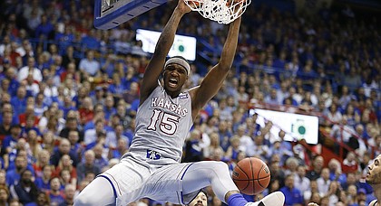 Kansas forward Carlton Bragg Jr. (15) delivers on a put back dunk during the first half, Wednesday, Feb. 22, 2017 at Allen Fieldhouse.