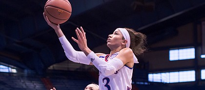 Kansas junior Jessica Washington drives in for a layup during the team's exhibition game against Washburn University on Sunday, Nov. 6, 2016.