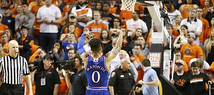 Kansas guard Frank Mason III (0) bids farewell to the OSU student section following the Jayhawks' 90-85 win, Saturday, March 4, 2017 at Gallagher-Iba Arena.