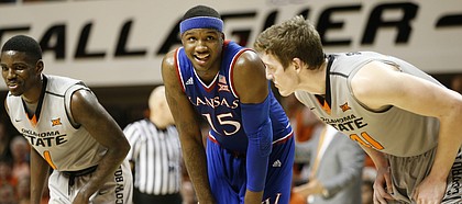 Kansas forward Carlton Bragg Jr. (15) flashes a smile while waiting for a free throw during the first half, Saturday, March 4, 2017 at Gallagher-Iba Arena.