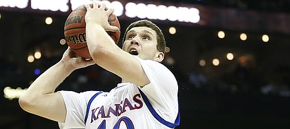 Kansas guard Sviatoslav Mykhailiuk (10) heads in for a bucket past TCU guard Kenrich Williams (34) during the first half, Thursday, March 9, 2017 at Sprint Center.