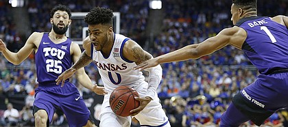 Kansas guard Frank Mason III (0) cuts to the bucket past TCU guard Desmond Bane (1) during the first half, Thursday, March 9, 2017 at Sprint Center.