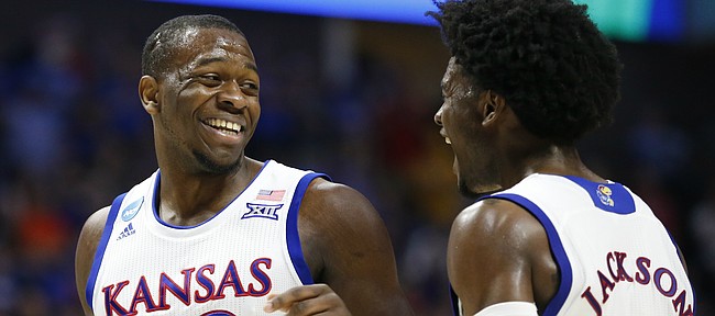 Kansas forward Dwight Coleby (22) and Kansas guard Josh Jackson (11) have a laugh after a bucket by Coleby and a Michigan State foul during the second half on Sunday, March 19, 2017 at BOK Center in Tulsa, Okla.