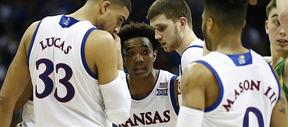 Kansas guard Devonte' Graham (4) tries to pull the Jayhawks together during the second half on Saturday, March 25, 2017 at Sprint Center.