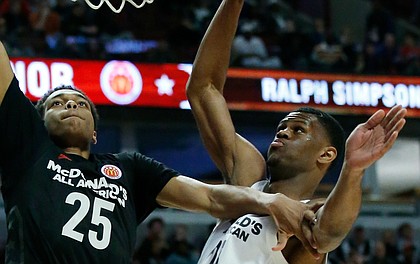 Big East's Lonnie Walker IV, left, drives to the basket against Big West's Billy Preston during the second half of the McDonald's All-American boys high school basketball game Wednesday in Chicago. Big West won 109-107.
