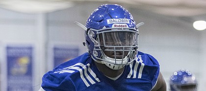A transfer from Alabama, offensive lineman Charles Baldwin sat out the 2016 season at Kansas. This spring, the 6-foot-5, 305-pound junior right tackle finally gets to practice with the first-stringers on offense, as the Jayhawks begin preparation for the 2017 season.