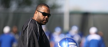 Kansas running backs coach Tony Hull watches over his players during practice on Thursday, April 6, 2017.