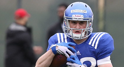 Kansas receiver Ryan Schadler pulls in a pass during spring football practice on Thursday, March 30, 2017.