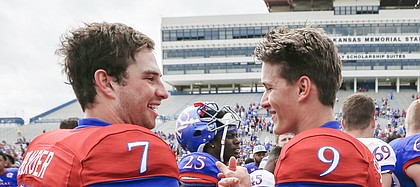 Competing quarterbacks Team Jayhawk quarterback Peyton Bender (7) and Team KU quarterback Carter Stanley (9) shake hands after the 2017 Spring Game on Saturday, April 15 at Memorial Stadium.