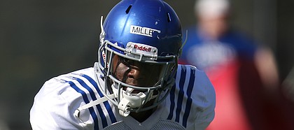 Kansas safety Tyrone Miller Jr. takes off as he works through a drill during practice on Tuesday, April 11, 2017.