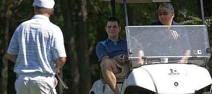 Former KU golfer and current PGA player Gary Woodland, left, and former KU golf coach Ross Randall spectate at Alvamar Country Club Thursday, Sept. 17, 2009.