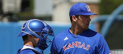 Kansas University starter Jackson Goddard and catcher Michael Tinsley talk during the third inning as the Texas Tech runs begin to pile up on Saturday, May 7, 2016 at Hoglund Ballpark.