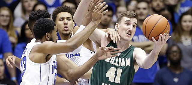 Duke's Chase Jeter, rear, Matt Jones, left, and William & Mary's Jack Whitman (41) reach for the ball during the first half of an NCAA college basketball game in Durham, N.C., Wednesday, Nov. 23, 2016.
