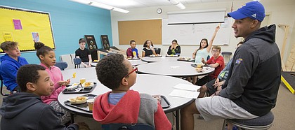 Former Kansas basketball forward Landen Lucas talks about what it's like to dunk on an opposing player after the question was asked by sixth-grader Davon Davis on Friday, May 5, 2017 at South Middle School.