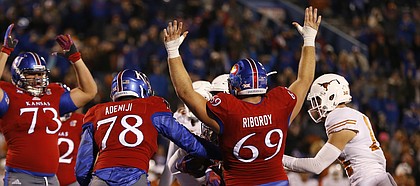 The Jayhawks signal a touchdown by Kansas running back Khalil Herbert (10) during the fourth quarter on Saturday, Nov. 19, 2016 at Memorial Stadium.