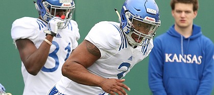 Kansas linebacker Maciah Long shuffles over a line of pads during spring football practice on Tuesday, March 28, 2017.