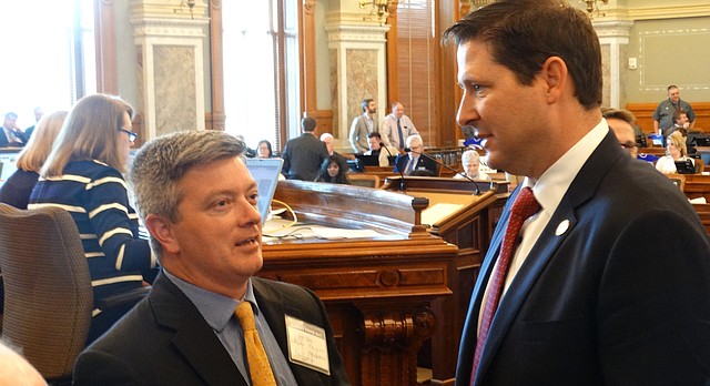 Jeff King, left, a former senator now serving as the Legislature's legal counsel on school finance, confers with House Speaker Ron Ryckman during debate in the House on a new school funding system aimed at satisfying a Kansas Supreme Court decision that declared current funding inadequate and unconstitutional.