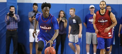 Blue Team guard Marcus Garrett brings the ball up the court during a scrimmage on Wednesday, June 7, 2017 at the Horejsi Family Athletics Center.