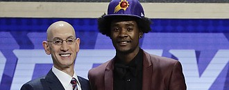 Kansas' Josh Jackson, right, poses for a photo with NBA Commissioner Adam Silver after being selected by the Phoenix Suns as the fourth pick overall during the NBA basketball draft, Thursday, June 22, 2017, in New York.