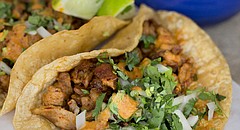 Tacos pastor with onions, cilantro and adobo sauce at La Estrella, 2449 Iowa St.,
Suite D.