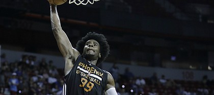 Phoenix Suns' Josh Jackson shoots over Dallas Mavericks' Carrick Felix during the second half of an NBA summer league basketball game, Sunday, July 9, 2017, in Las Vegas.