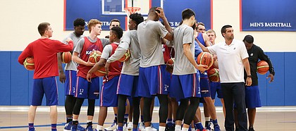 The Jayhawks come together in a huddle to start practice on Tuesday, July 11, 2017. The Jayhawks are preparing for four early-August exhibition games in Italy.