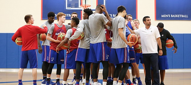The Jayhawks come together in a huddle to start practice on Tuesday, July 11, 2017. The Jayhawks are preparing for four early-August exhibition games in Italy.