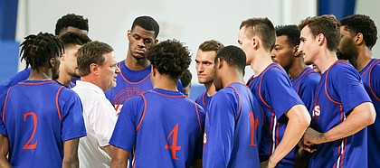 Kansas head coach talks with his players before a scrimmage on Wednesday, June 7, 2017 at the Horejsi Family Athletics Center.