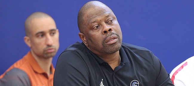 Georgetown head coach Patrick Ewing, front watches during the Hardwood Classic on Friday, July 21, 2017 at Sports Pavilion Lawrence. In back is Texas head coach Shaka Smart.