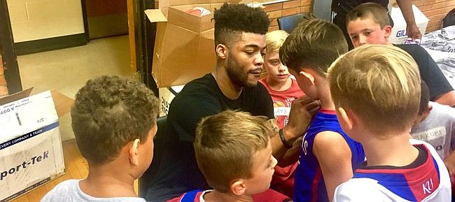 Former Kansas point guard Frank Mason III signs autographs for a group of campers on Friday, July 28, 2017 at Lawrence High. The camp was the second of a four-day stretch of clinics put on by the new Sacramento Kings guard. 