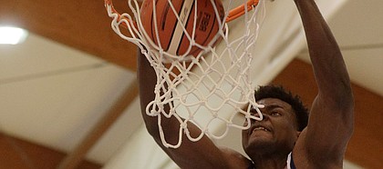 Kansas University's Udoka Azubuike goes for a slam dunk during a basketball game in Rome, Thursday, Aug. 3, 2017.