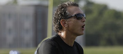Kansas offensive coordinator Doug Meacham instructs players during the team's second practice of fall camp on Tuesday, Aug. 1, 2017.
