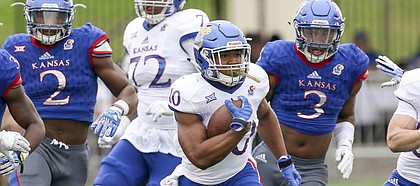 Team Jayhawk running back Khalil Herbert (10) charges up the field on a run during the third quarter of the 2017 Spring Game on Saturday, April 15 at Memorial Stadium.