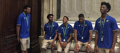 Kansas players, from left to right, K.J. Lawson, Lagerald Vick, Charlie Moore, Billy Preston and Marcus Garrett share a laugh while waiting at the exit of St. Peter's Basilica during the Jayhawks tour of Vatican City on Thursday, Aug. 3, 2017.