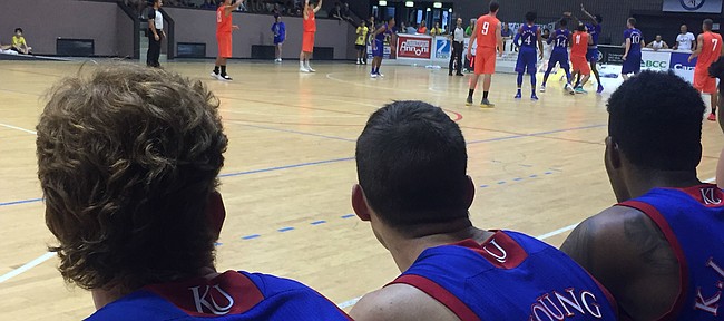 After starring at Lansing High and moving on to Kansas City Kansas Community College, KU walk-on Clay Young's journey with the Jayhawks has taken him places he never would have imagined he'd go. Here Young watches intently from the bench during KU's fourth and final exhibition game in Milan, Italy on Sunday, Aug. 6, 2017. 