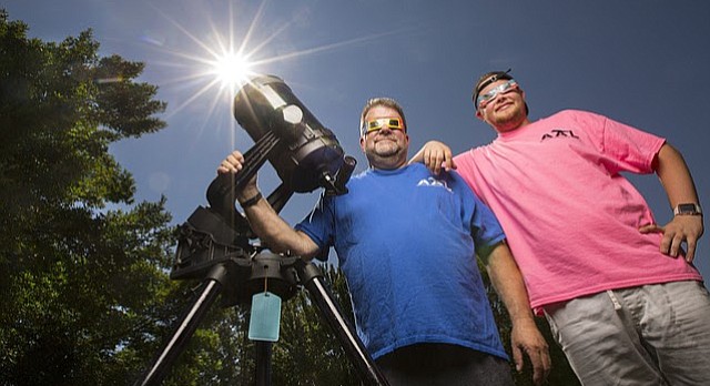 Rick Heschmeyer, left, president of the Astronomical Associates of Lawrence, will be heading to St. Joseph, Mo., with his son, Michael, to experience the eclipse within the path of totality. Heschmeyer has been an amateur astronomer for about 30 years, he says.