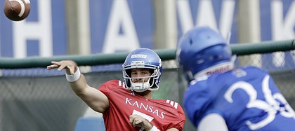 Kansas junior quarterback Peyton Bender fires a pass during a preseason practice on Monday, Aug. 7, 2017.