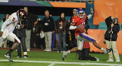 Kansas cornerback Aqib Talib high-steps into the end zone after picking off a pass during the first half as quarterback Tyrod Taylor (5) pursues. Talib was named MVP of the Jayhawks' 24-21 victory over Virginia Tech in the Orange Bowl on Thursday in Miami. Kansas University athletics officials have scheduled a free public event to celebrate the football team's Orange Bowl victory.