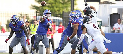 Kansas quarterback Peyton Bender (7) throws a touchdown pass to wide receiver Steven Sims Jr. (11) during the first quarter on Saturday, Sept. 2, 2017 at Memorial Stadium.