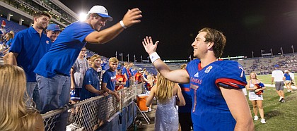 Kansas quarterback Peyton Bender (7) slaps hands with fans following the Jayhawks' 38-17 win over Southeast Missouri on Saturday, Sept. 2, 2017 at Memorial Stadium.