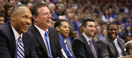 Kansas head coach Bill Self and his staff have a laugh during the Senior Night speeches following the JayhawksÕ 73-63, comeback win over Oklahoma.