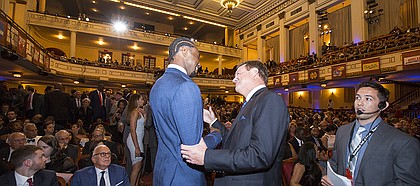University of Kansas head basketball coach Bill Self is greeted by former player and current Minnesota Timberwolves player Andrew Wiggins during the Naismith Memorial Basketball Hall of Fame induction ceremony on Friday, Sept. 8 2017 at Symphony Hall in Springfield, Massachusetts.