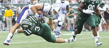 Kansas wide receiver Chase Harrell (3) is taken off of his feet as he is hit by Ohio cornerback Bradd Ellis (3) during the fourth quarter on Saturday, Sept. 16, 2017 at Peden Stadium in Athens, Ohio.