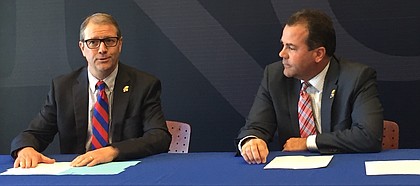 New Kansas chancellor, Doug Girod, left, and KU athletic director Sheahon Zenger, discuss with reporters plans for the athletic department's “Raise The Chant” fund-raising strategy, a facility-focused endeavor which focuses primarily on football and aims to raise $350 million over the course of five years.