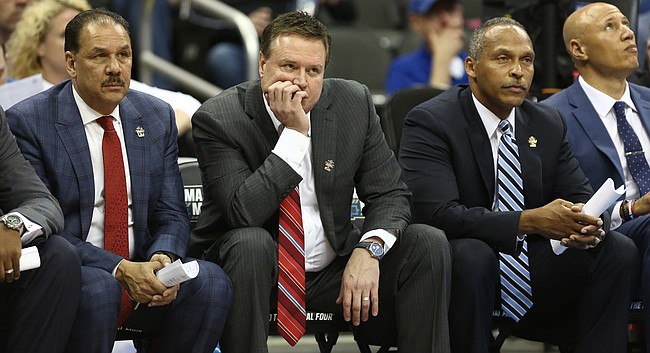 Kansas head coach Bill Self and his staff watch from the bench late during the second half on Saturday, March 25, 2017 at Sprint Center.